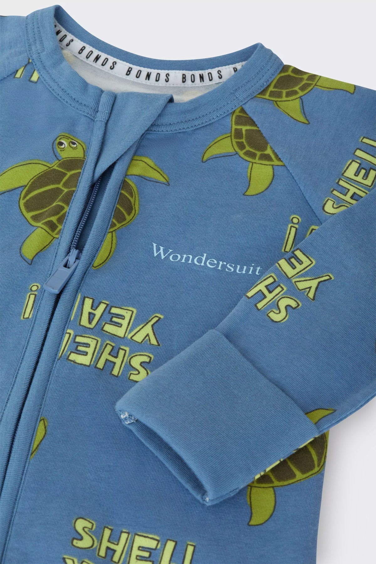 Bonds Zip Wondersuit baby sleepsuit in Shell Yeah blue turtle print. Close up two-way zip and hand cuff.