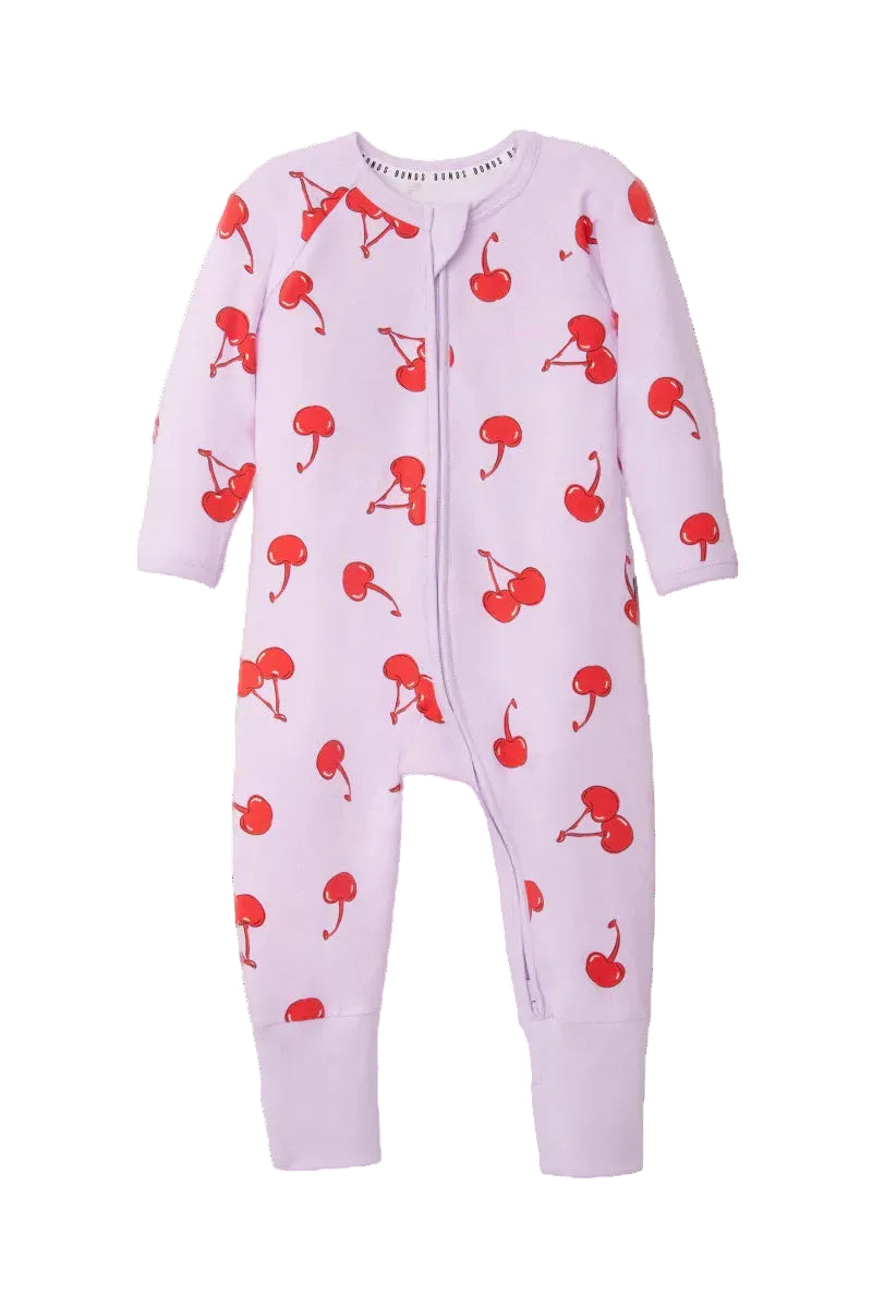 Bonds Zip Wondersuit baby sleepsuit in Cherry Picnic purple fruity print. Front view.