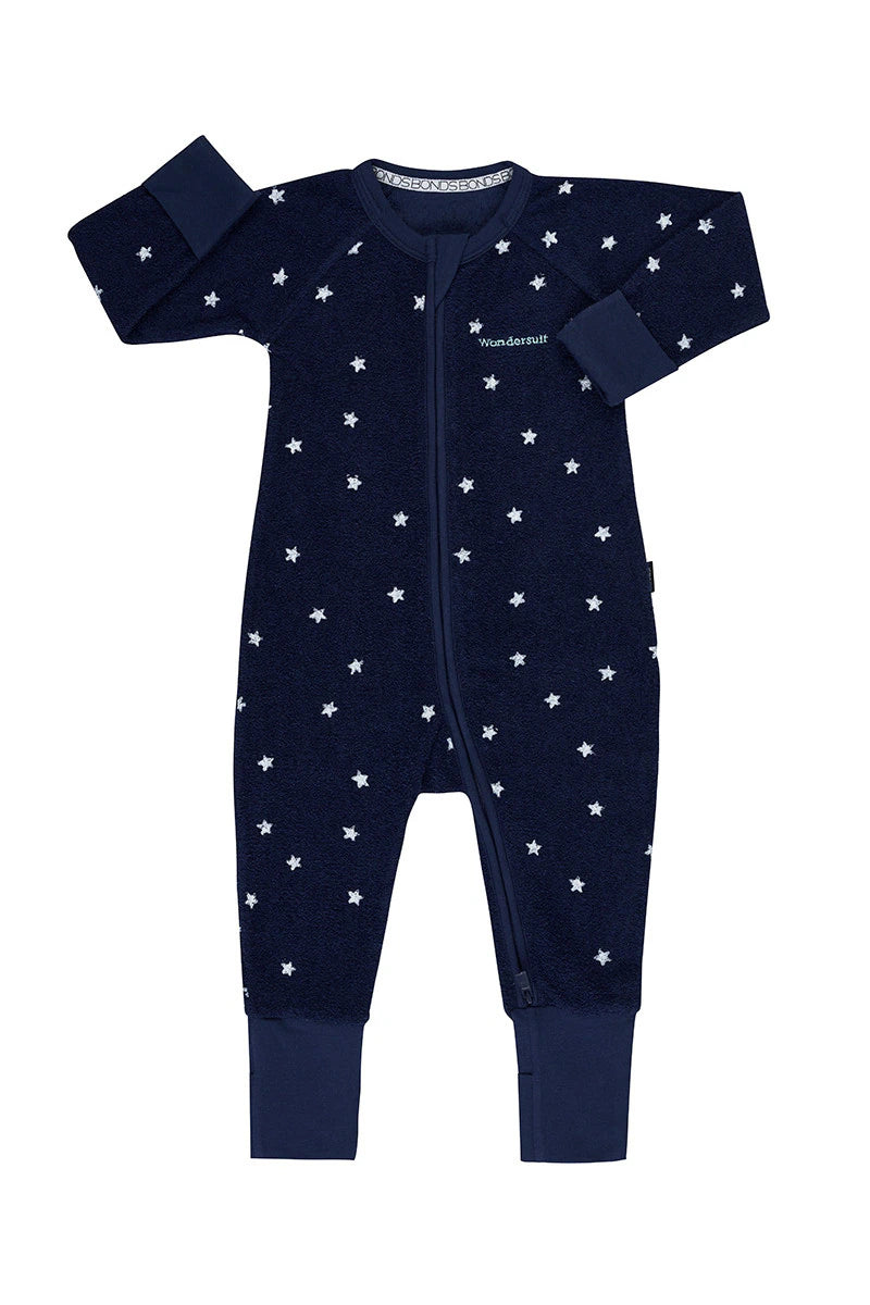 Bonds Poodlette Zip Wondersuit baby sleepsuit in Star Shine Navy star print. Front view.