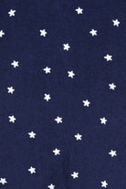 Bonds Poodlette Zip Wondersuit baby sleepsuit in Star Shine Navy star print. Close up.