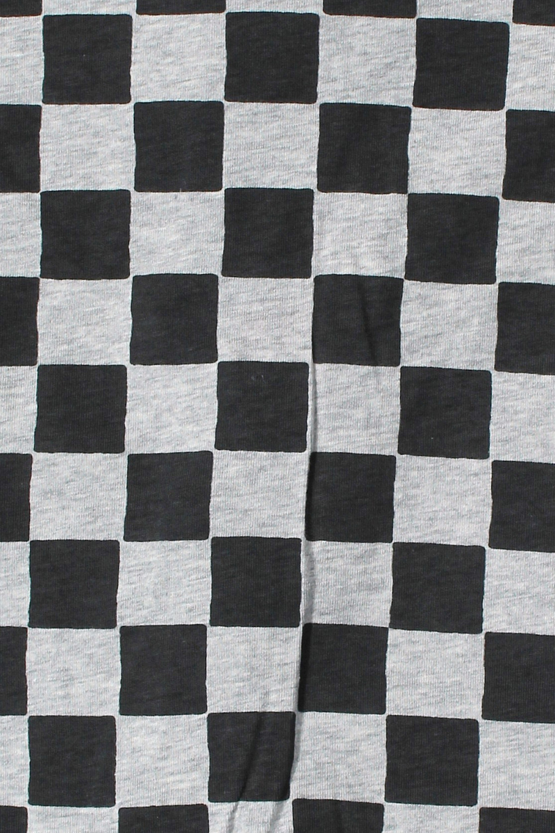 Bonds Zip Wondersuit baby sleepsuit in Check It Out black and grey check print. Close up.