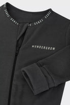 Bonds WonderGrow Zip Wondersuit bamboo baby sleepsuit in La Femme Nikita black. Close up of zip and rollable cuff.