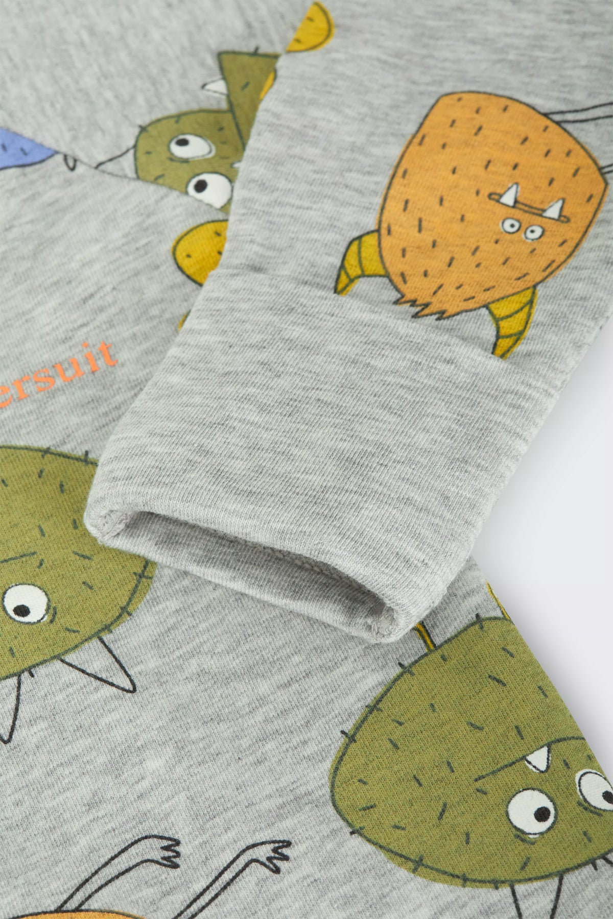 Bonds Zip Wondersuit baby sleepsuit in Boo Buddy Marle grey monster print. Close up hand cuff.