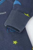 Bonds Zip Wondersuit baby sleepsuit in Out of This World navy outer space rocket print. Close up hand cuff.