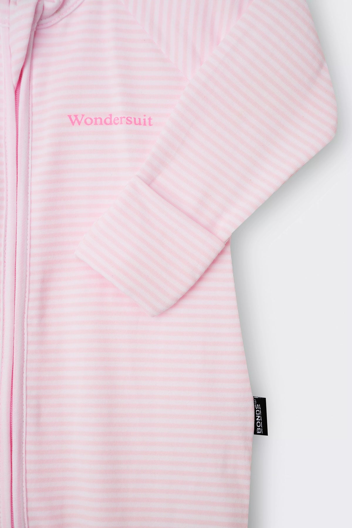 Bonds Zip Wondersuit baby sleepsuit in Ballet Pink and white stripe. Close up hand cuff.