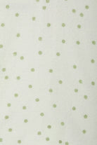 Bonds Poodlette Zip Wondersuit baby sleepsuit in Ditsy Dot Green polka dot print. Close up.