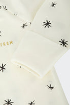 Bonds WonderFresh Short Leg Wondersuit baby onesie in Crayon Star cream print. Close up hand cuff.