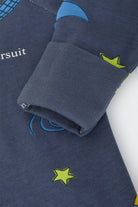 Bonds Zip Wondersuit baby sleepsuit in Out of This World navy outer space rocket print. Close up hand cuff.