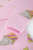Bonds Zip Wondersuit baby sleepsuit in Sundae Swirls pink ice-cream print. Close up hand cuff.