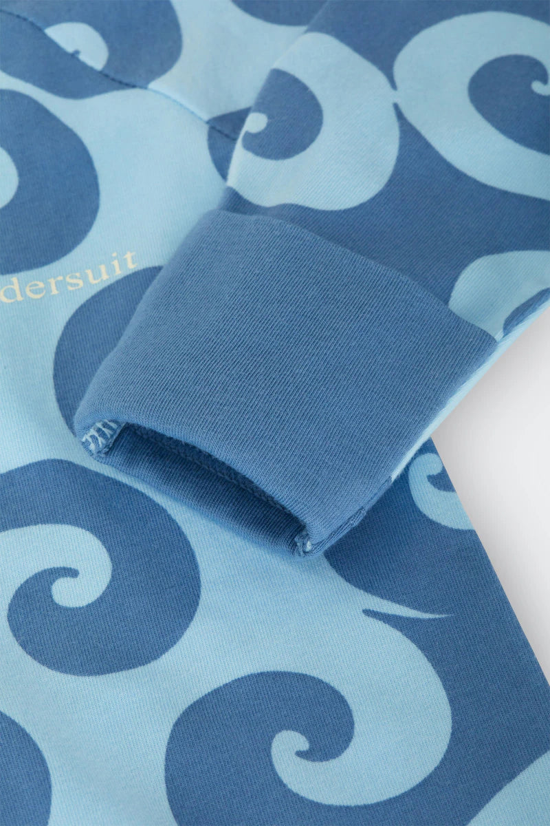 Bonds Zip Wondersuit baby sleepsuit in Wave Wonders blue wave swirl print. Close up hand cuff.