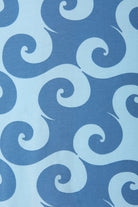 Bonds Zip Wondersuit baby sleepsuit in Wave Wonders blue wave swirl print. Close up.