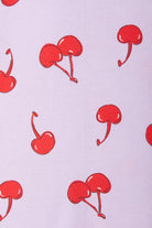 Bonds Zip Wondersuit baby sleepsuit in Cherry Picnic purple fruity print. Close up.
